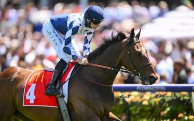 Team Captain Flies the VIC Husslers Flag at Flemington